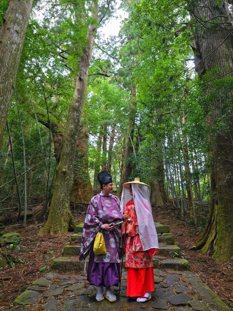 Hiking through the ancient Kumano Kodo trail while dressing up in Heian period costumes.